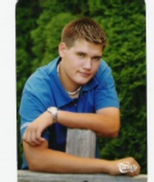 shawn - Shawn leaning against fence