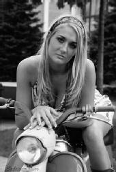 Laura - Hippie chic on '59 moped