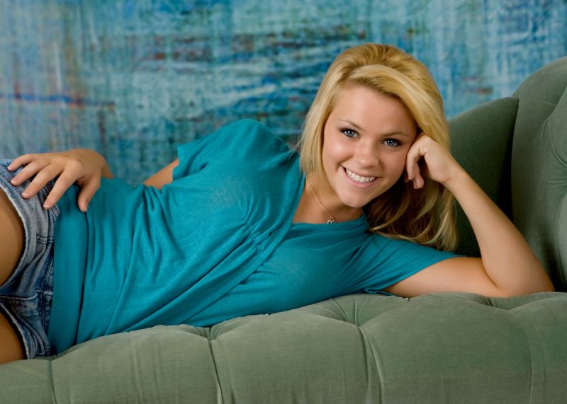 Chelsea Hahn - aqua shirt on couch