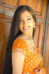 Shilpa - HeadShot_Orange 1